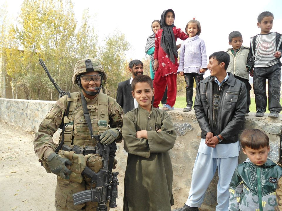 Major Jasmine Walker Motupalli with civilians in Logar Province, Afghanistan